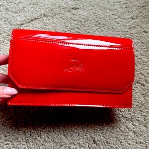 Louboutin red clutch